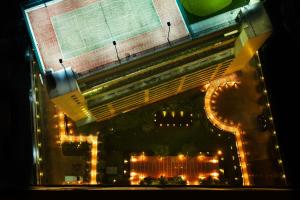 an overhead view of a building with lights at night at Marriott Executive Apartments Sukhumvit Park, Bangkok in Bangkok +86 photos