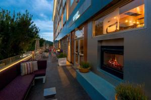 a building with a fireplace on the side of it at Aloft Asheville Downtown in Asheville