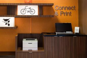 an office with a desk with a laptop and a printer at Fairfield Inn & Suites Des Moines West in West Des Moines