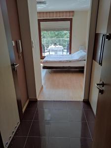 a view of a bedroom with a bed and a table at Apartament w Juracie in Jurata