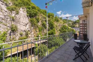 a balcony with a table and a mountain at Stunning apartment in quiet street near center With free parking 4 floor in Rijeka