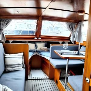 a view of the inside of a boat with a table at Venerent in Helsinki