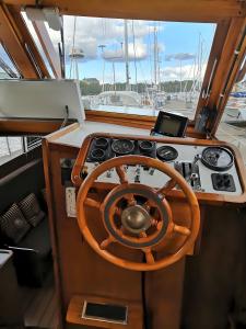 a steering wheel and dashboard of a boat at Venerent in Helsinki