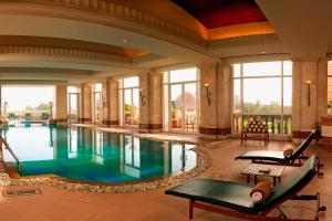 a pool in a hotel lobby with a swimming pool at ITC Grand Central, a Luxury Collection Hotel, Mumbai in Mumbai