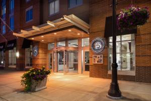 a building with flowers in front of a building at Sheraton Duluth Hotel in Duluth