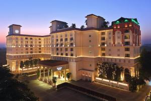 an aerial view of a hotel at night at Sheraton Grand Pune Bund Garden Hotel in Pune