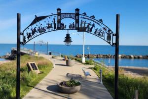 a group of people walking under an arch at the beach at Beautiful 4 bedroom in Cleveland in Euclid