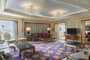 a large living room with a couch and a tv at Le Meridien Makkah in Mecca