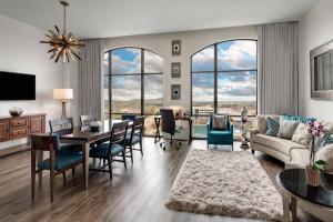 a living room with a couch and a table at Element Huntsville in Huntsville