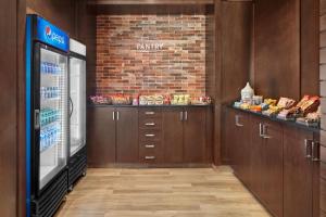 a fast food restaurant with a cash register and a grocery store at Four Points by Sheraton Sherwood Park in Sherwood Park