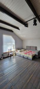 a room with two beds and a bench in it at Трушки34 in Trushki +121 photos
