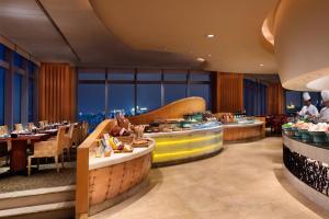 a restaurant with a view of the city at JW Marriott Shanghai at Tomorrow Square in Shanghai