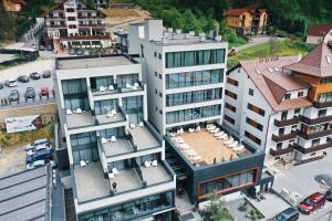 an aerial view of a building in a city at Fabesca Boutique Hotel & SPA in Sovata