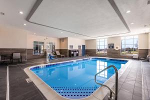 a large swimming pool in a hotel room at Four Points by Sheraton Elkhart in Elkhart