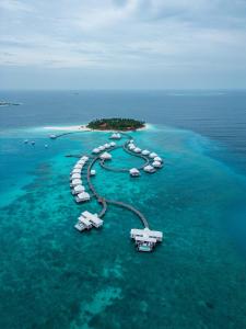 an aerial view of a resort island in the ocean at Diamonds Thudufushi Maldives Resort & Spa in Thundufushi