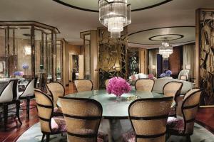 a dining room with a table and chairs at The Ritz-Carlton Shanghai, Pudong in Shanghai