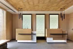 a lobby with four windows and two tables at Fairfield by Marriott Kyoto Amanohashidate in Miyazu