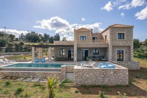 a villa with a swimming pool and a house at Sea View Villa Mia Casa with Private Pool, Ping-Pong & BBQ in Langá +36 photos