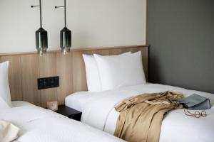 Un pat sau paturi într-o cameră la Fairfield by Marriott Kyoto Amanohashidate