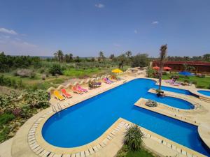 an overhead view of a pool at a resort at Tunis Pyramids Hotel - فندق اهرامات تونس in Tunis
