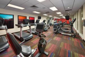 a gym with several treadmills and cardio machines at Courtyard by Marriott Times Square West in New York