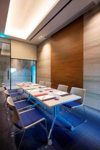 a large conference room with a long table and chairs at Aloft Seoul Gangnam in Seoul