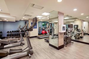 a gym with treadmills and elliptical machines at Four Points by Sheraton Midtown - Times Square in New York