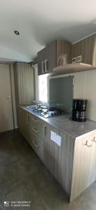 A kitchen or kitchenette at Camping LE Moulin