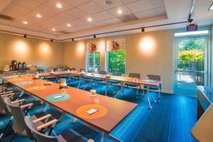 a large conference room with tables and chairs at Aloft Portland Airport Hotel at Cascade Station in Portland