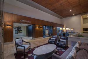 a lobby of a hotel with chairs and a table at Sheraton Santo Domingo in Santo Domingo +37 photos