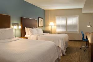 Ein Bett oder Betten in einem Zimmer der Unterkunft Four Points by Sheraton Cocoa Beach