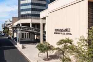 a building with a sign on the side of it at Renaissance Mobile Riverview Plaza Hotel in Mobile