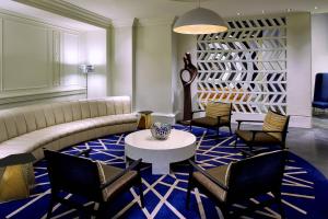 a living room with a couch and chairs and a table at Hotel Colonnade Coral Gables, Autograph Collection in Miami