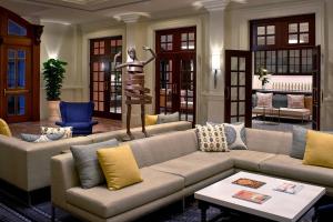 a living room with a couch and a statue at Hotel Colonnade Coral Gables, Autograph Collection in Miami