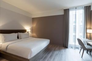 Postel nebo postele na pokoji v ubytování AC Hotel by Marriott Wuerzburg
