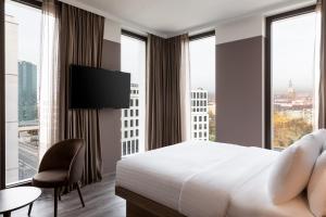 Postel nebo postele na pokoji v ubytování AC Hotel by Marriott Wuerzburg