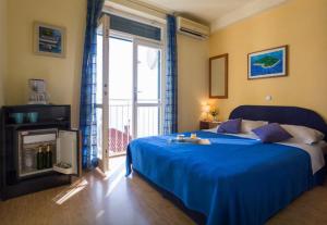 Postel nebo postele na pokoji v ubytování Dubrovnik Residence Nodilo