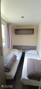 Postel nebo postele na pokoji v ubytování Camping LE Moulin