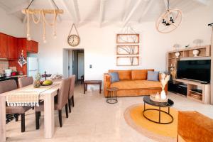 a living room with a couch and a table at Elais House Methoni in Methoni