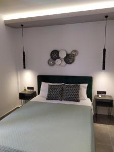 A bed or beds in a room at Studios Periklis