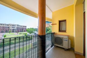 a balcony with a heater and a view of a street at [10min dalla Ghirlandina] Love and relax in Modena in Modena