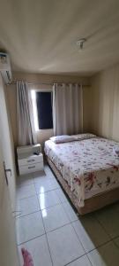 A bed or beds in a room at Residencial Viver Ananindeua