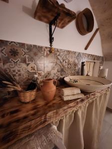 a bathroom with a counter with a sink on it at Nene' in Fasano +22 photos