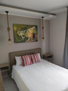 A bed or beds in a room at Studios Periklis