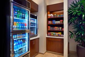 a refrigerator filled with lots of sodas and drinks at SpringHill Suites by Marriott at Anaheim Resort Area/Convention Center in Anaheim