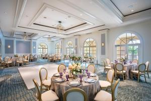 a banquet room with tables and chairs and windows at The Ritz-Carlton, Sarasota in Sarasota +37 photos