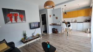 a living room with a kitchen and a living room at Golfe Juan Studio in Vallauris