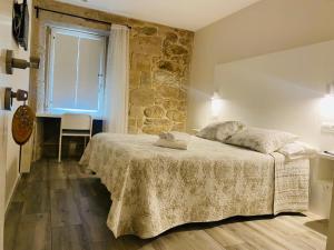 Posteľ alebo postele v izbe v ubytovaní Hospedaje CasaSampedro + 8 fotografií