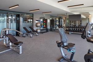 a gym with a bunch of treadmills and machines at Courtyard by Marriott Montreal Midtown in Montréal