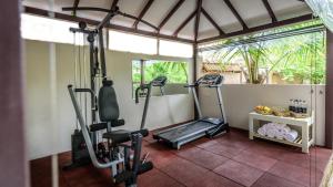 a gym with two tread machines in a room at Argo by Trance in Dabolim
